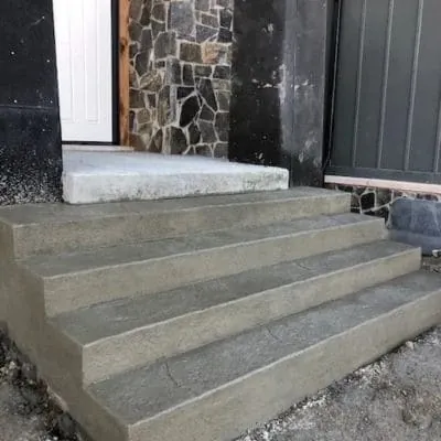 New poured concrete front steps at a stone-front house